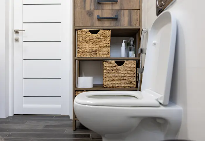 Licensed plumber from B & C Plumbing performing toilet repair and installation in Huntsville, Alabama