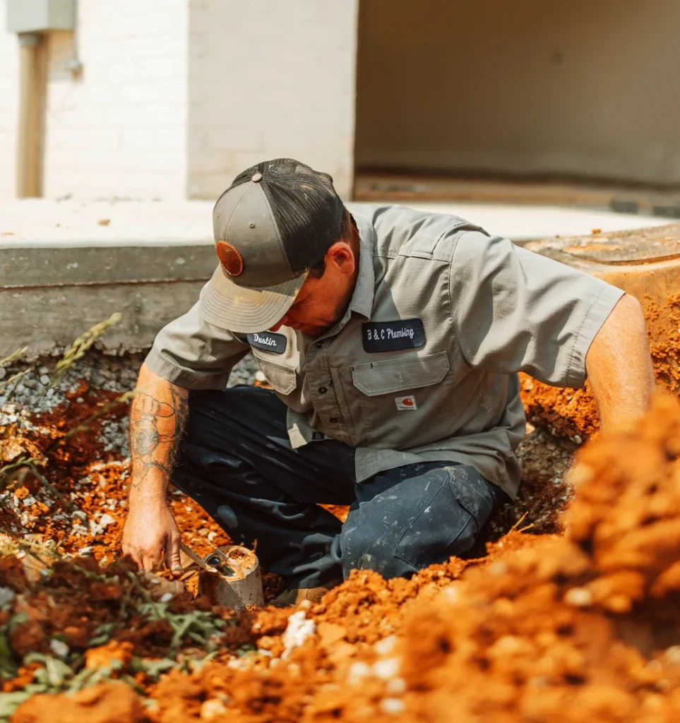 B&C Plumbing technician performing commercial plumbing drain cleaning in Huntsville